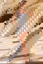 Short black dress with structured white overskirt and long train