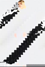 Three-quarter rear angle of black jumpsuit highlighting tailored fit