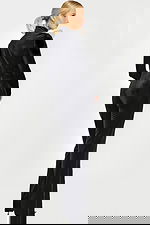 Back view of fitted long-sleeve black jumpsuit with high neckline