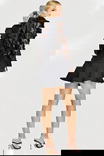 Back view of ruffled lace blouse with floral pattern and layered mini skirt