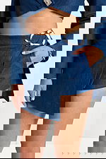 Designer denim outfit featuring cutout blazer and metallic belt detail