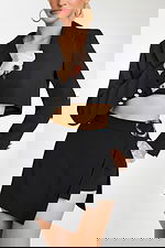 Close-Up of Rhinestone Button Blazer and Asymmetrical Skirt with Metallic Buckle Detail