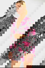 Detail shot of floral tweed fabric and silver buckle on skirt waist