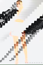 Model Wearing Black Textured Two-Piece Set with Cropped Blazer