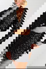 Close-Up of Black Mini Skirt and Crystal Buckle Detail