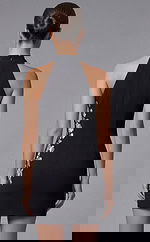 Back view of halter mini dress with clean lines and tailored fit