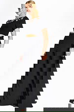 Side view of embellished black pantsuit with short sleeves and cutout waist