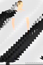 Back view of off-white blazer with contoured seam detailing