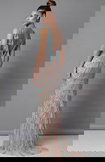 Back view of beaded column gown with open back and fitted silhouette