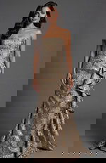 Strapless brocade gown with fitted silhouette and side drape