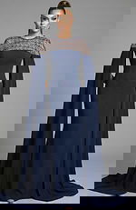 fitted gown with beaded illusion neckline and flowing cape sleeves