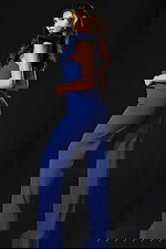 Elegant wide-leg jumpsuit with statement shoulder ruffle