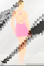 Full back view of red mini dress with black heels and bow detailing