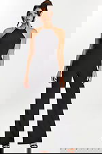 Front view of black halter jumpsuit with wide-leg silhouette