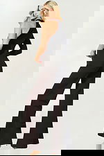 Elegant black jumpsuit featuring asymmetric neckline and flared legs