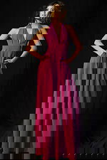 Elegant halter jumpsuit with open back and flowy wide-leg design