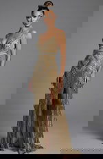 Front view of off shoulder gown with layered ruffled neckline and fitted silhouette