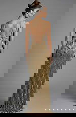 Back view of off shoulder gown with ruffled bodice and smooth flowing skirt