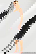 side view of black knee length dress 46641