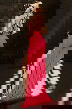 Halter gown with open back and high slit featuring flowing chiffon train