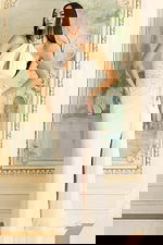 Halter gown with jeweled neckline, keyhole bodice, and ruched waist detailing