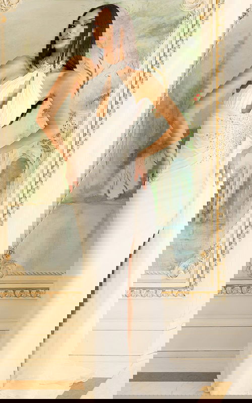 Halter gown with jeweled neckline, keyhole bodice, and ruched waist detailing