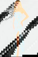 Strapless metallic gown with a fitted silhouette, thigh-high slit, and textured shimmer fabric creating a sculpted, elegant look.