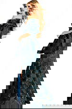 Off-shoulder metallic jacquard gown with structured draped sleeves, fitted bodice, and a floor-length slit skirt.