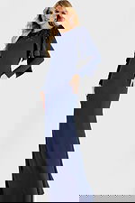 Elegant navy gown with long sleeves and embellished shoulder drape