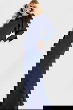 Elegant navy gown with long sleeves and embellished shoulder drape