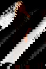 Elegant white midi dress with draped back and cold shoulder design