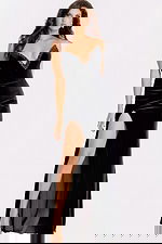 Elegant fitted black evening dress featuring high slit and floor-length hem