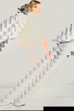 Front view of wide-leg bridal white jumpsuit with matching cape jacket