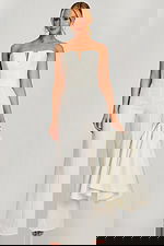 Strapless bridal jumpsuit back view with cape draped over shoulder