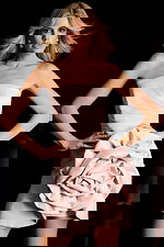 Elegant short strapless dress featuring large sculpted rose accent