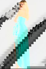 Strapless satin gown with ruched bodice and oversized floral accent