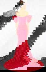 Back view of off shoulder mermaid gown with fitted silhouette and flowing train