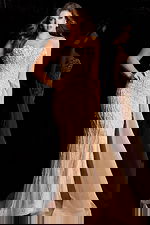 Glamorous long dress with cascading beads and flowing sheer train