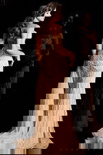 Elegant champagne mermaid dress featuring draped tulle sash and sparkling beadwork