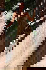 Jovani 46879 nude gold strapless A line prom dress with crystal beaded sheer corset bodice, high thigh slit, and flowing tulle skirt