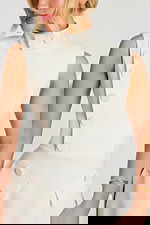 Close-up of structured bodice with button details and clean seams