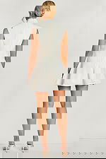 Back view of ivory A-line mini dress with hidden zipper and high neckline