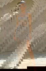 Beaded fringe gown with sheer corset bodice and fitted silhouette