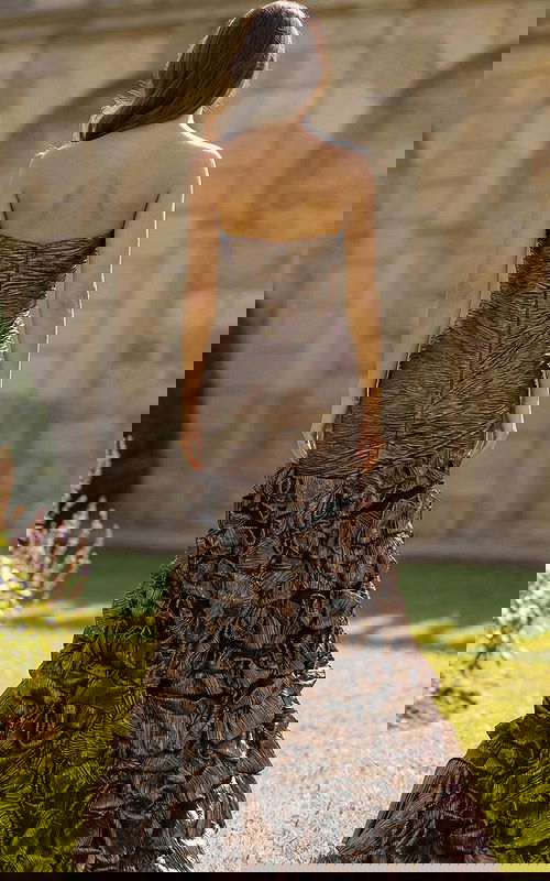 Elegant strapless gown with sculpted bodice and dramatic hem detail