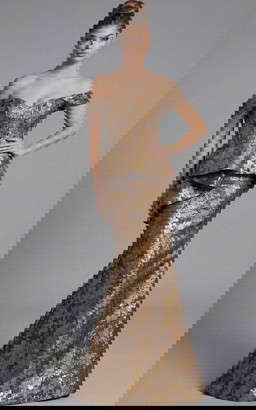 Front view of off shoulder mermaid gown with sculpted bodice, peplum detail, and metallic floral brocade