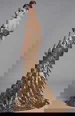 Back view of off shoulder mermaid gown with gold floral brocade fabric and sweeping train