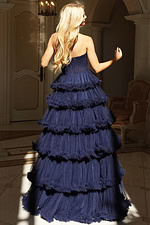 Strapless tiered tulle gown with layered ruffles and high slit