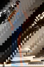 Fitted navy gown with beaded detailing and high leg slit