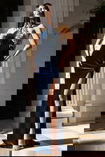 Navy halter gown with silver beaded embellishments and slit