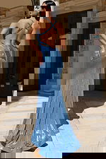 Sleek embellished gown with spaghetti straps and curve-hugging silhouette